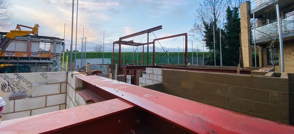 builder beam on construction site